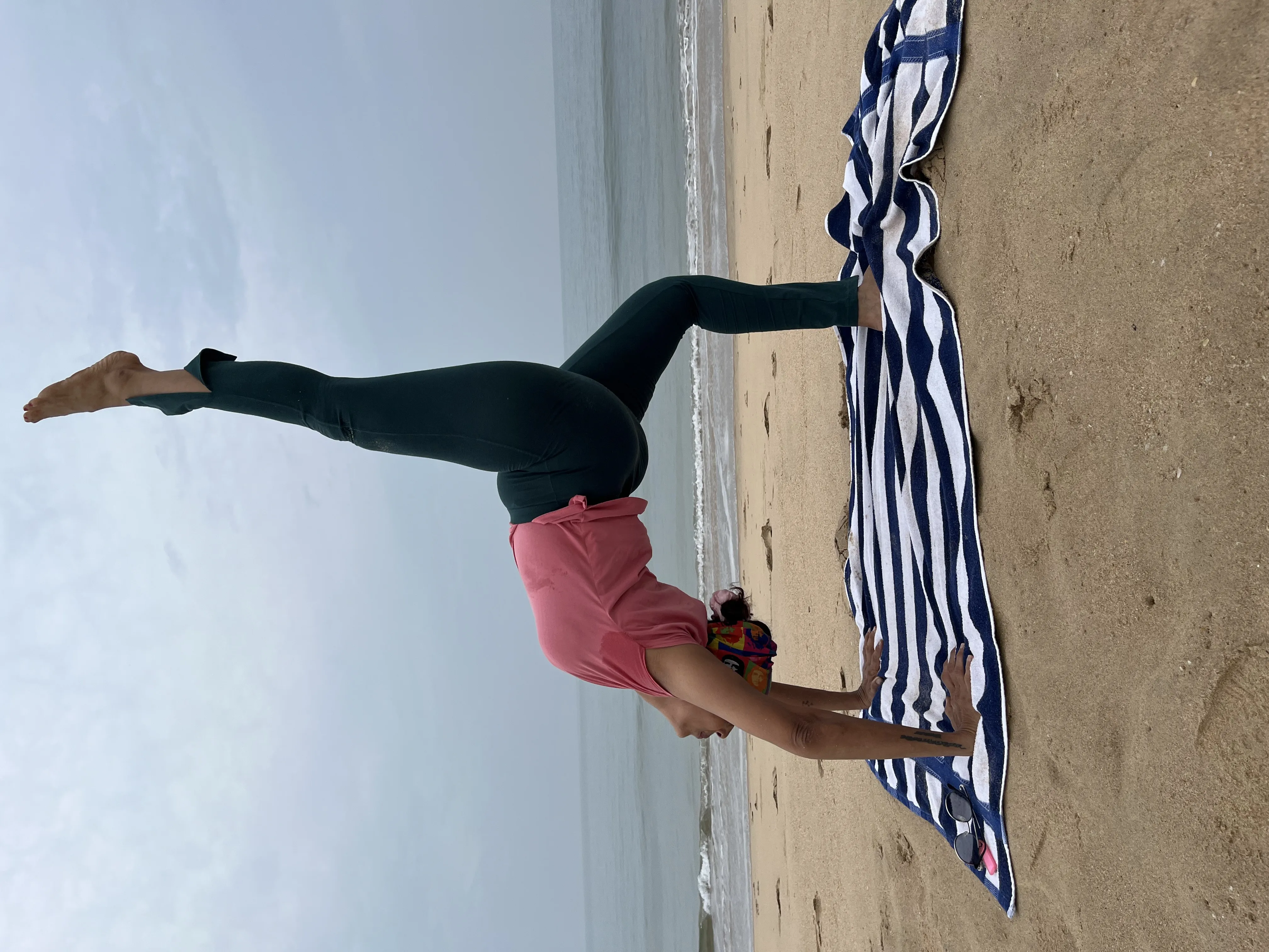 Yoga teacher smiling in lotus pose