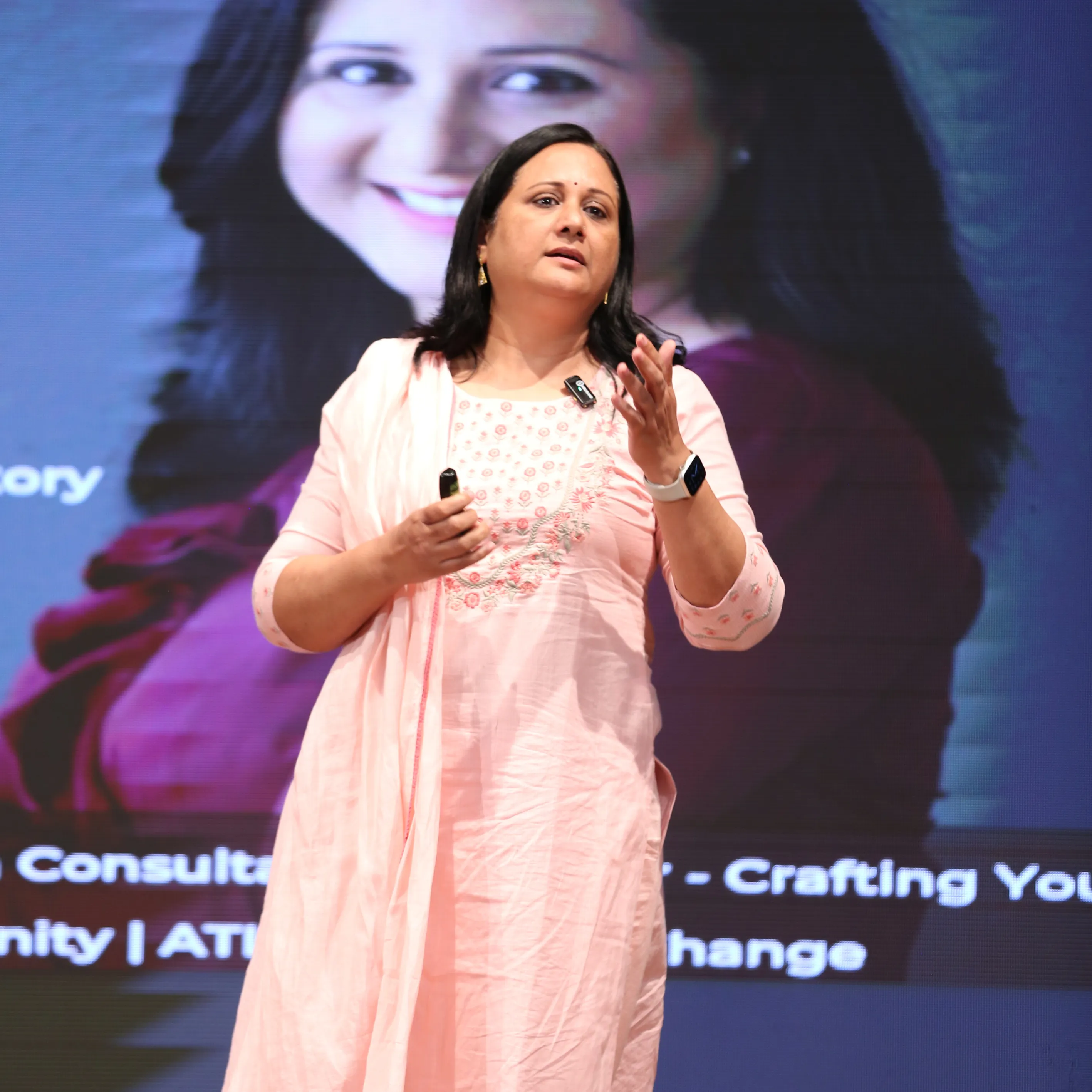 Shweta Ojha speaking on stage