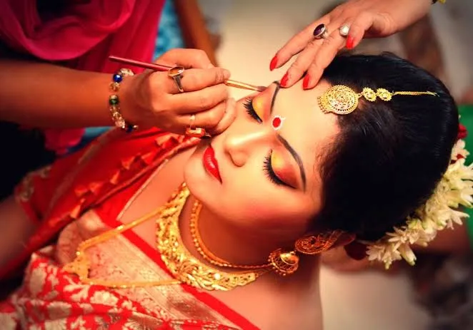 Beautiful close-up of an Indian bride in traditional attire and jewelry.