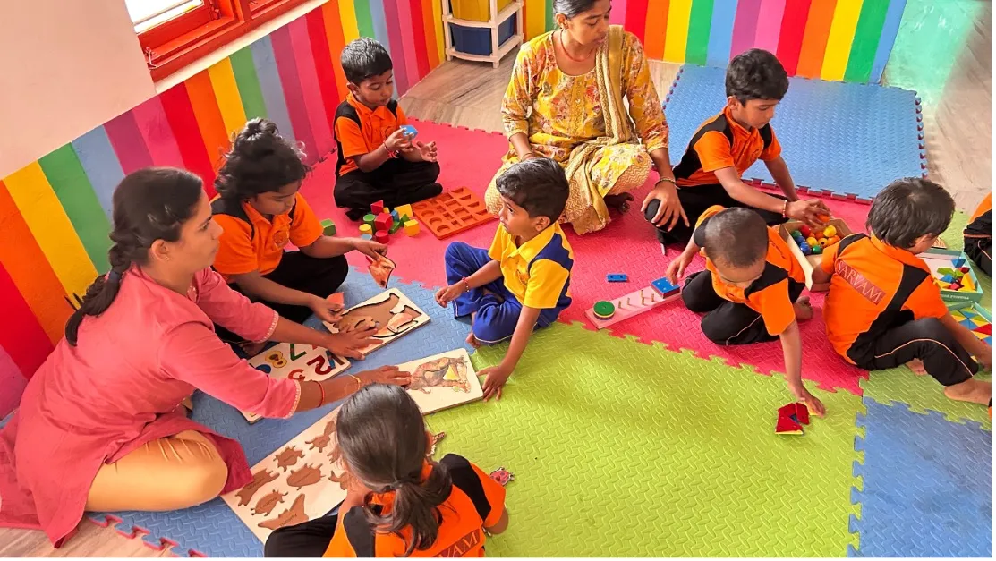 Indian children and teacher in ADHD and learning support small group