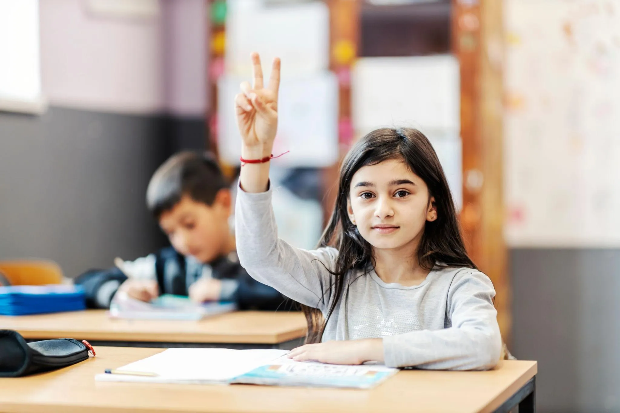 Confident student smiling while learning in class