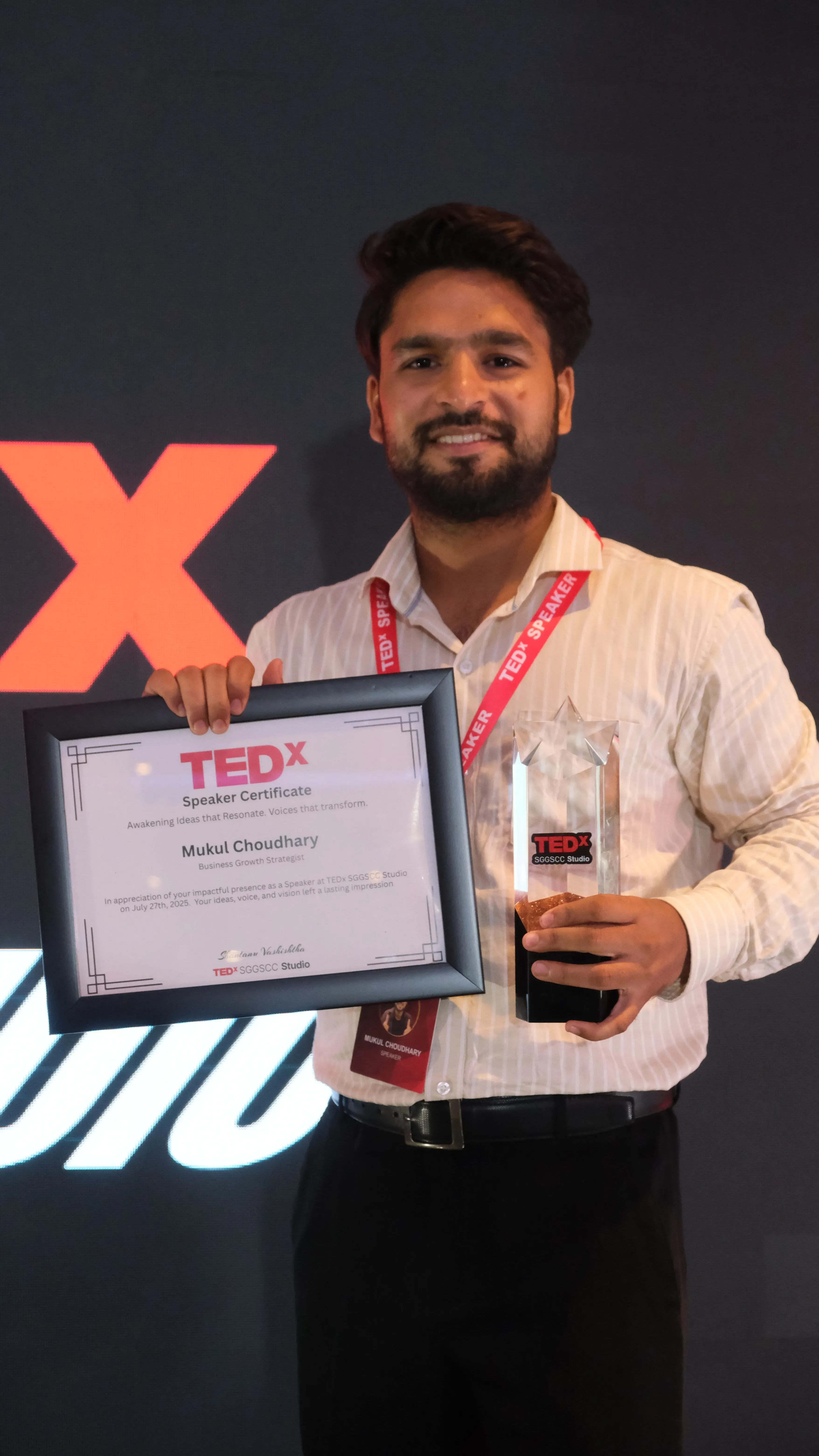 Scale My Marketing founder receiving a TEDx speaker recognition award on stage