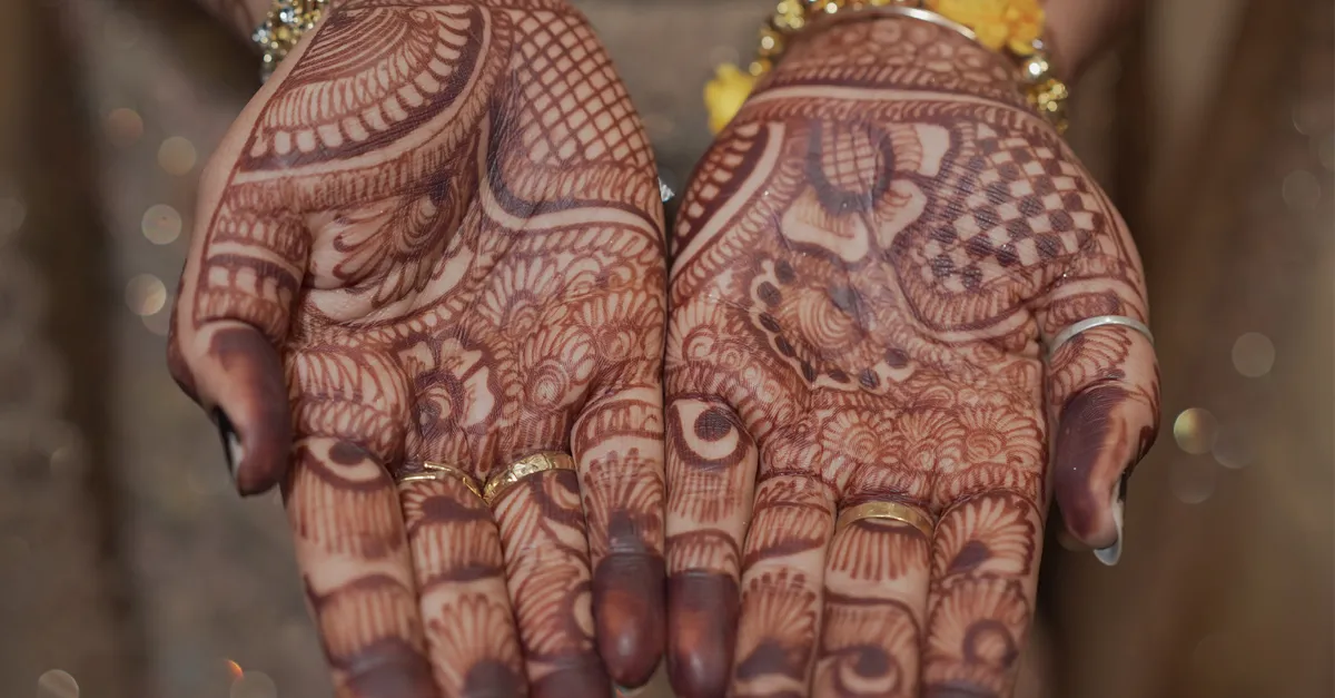 Energetic celebration at an Indian wedding featuring a drummer amidst a lively crowd in Goa, India.