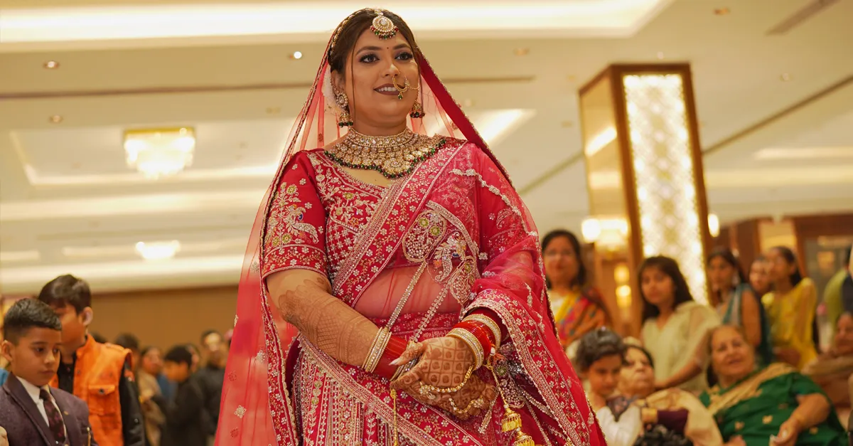 Smiling Indonesian Muslim couple in traditional attire during their joyful wedding celebration.